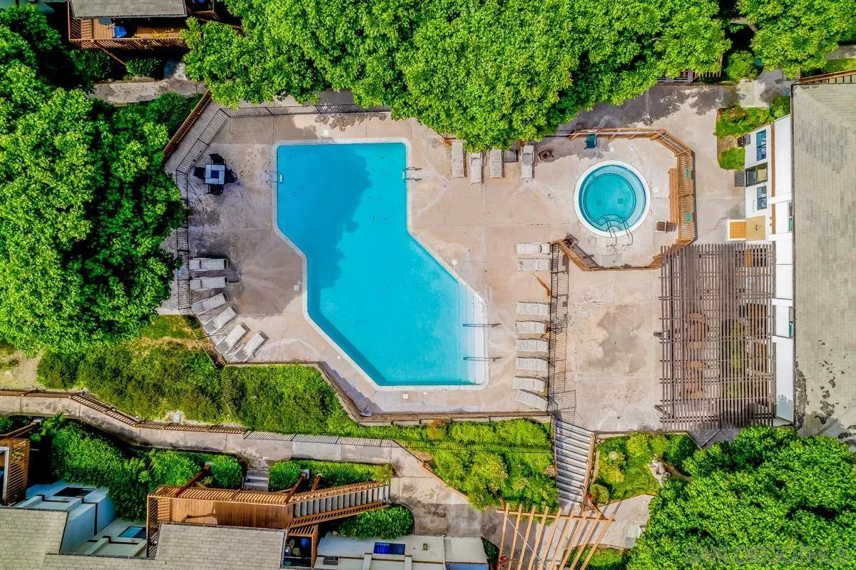 6386 Rancho Mission Road, Unit 305 San Diego, CA 92108 - Photo 24 of 28 an aerial view of a house with a yard and a large tree