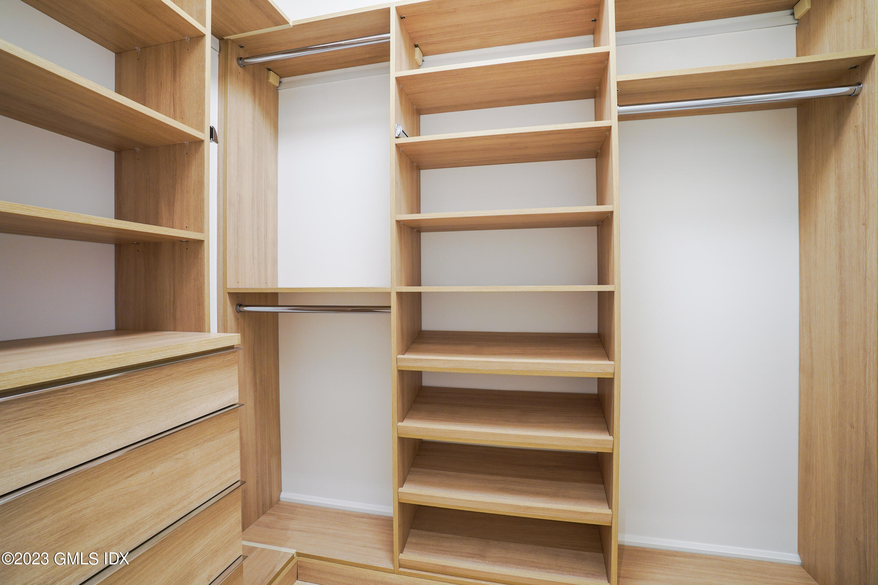 89 River Road, Unit 206 Cos Cob, CT 06807 - Photo 7 of 22 a view of walk in closet with empty racks