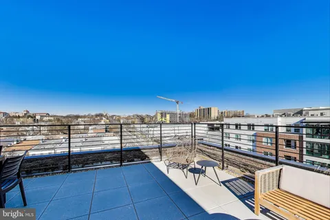 a view of a balcony with wooden floor with city view