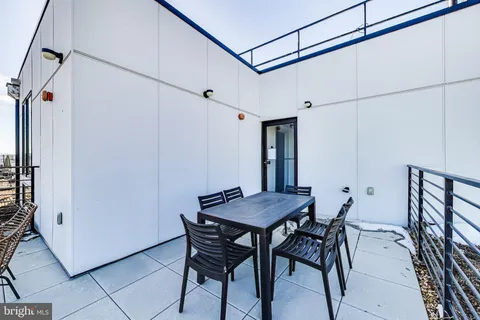 a view of a dining room and livingroom with furniture