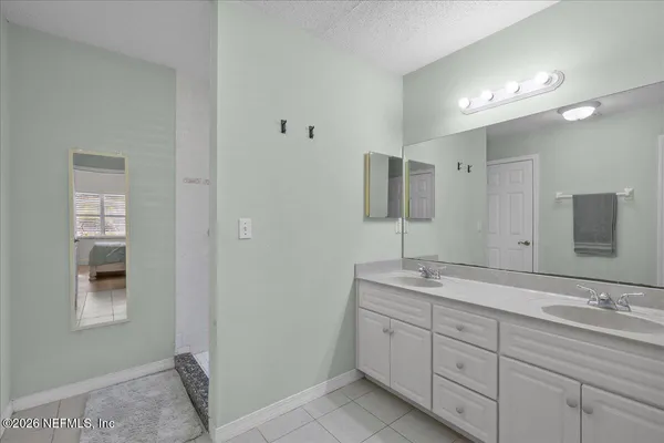 a view of a house with backyard porch and sitting area