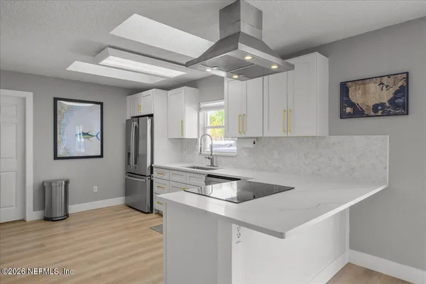 a living room with furniture and a ceiling fan