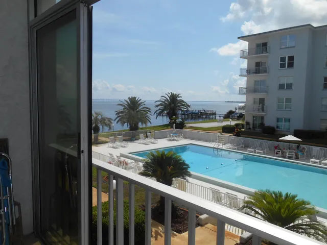 a bedroom with a bed and a mirror