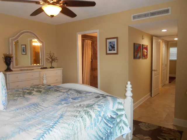 a view of a hallway with paintings on the wall
