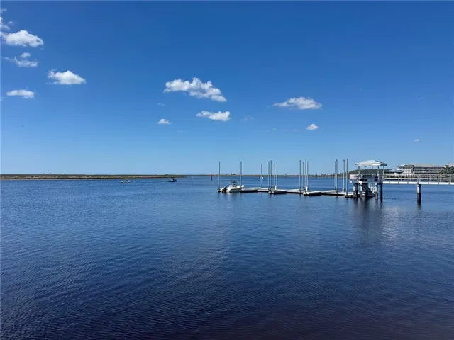 a view of a room with dining table & chairs