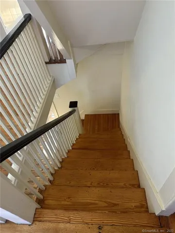 a view of a balcony with wooden floor