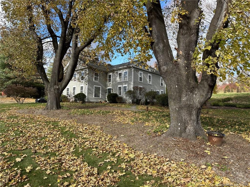 14 Quassuk Road, Unit 14 Woodbury, CT 06798 - Photo 2 of 23 a view of a yard with a tree