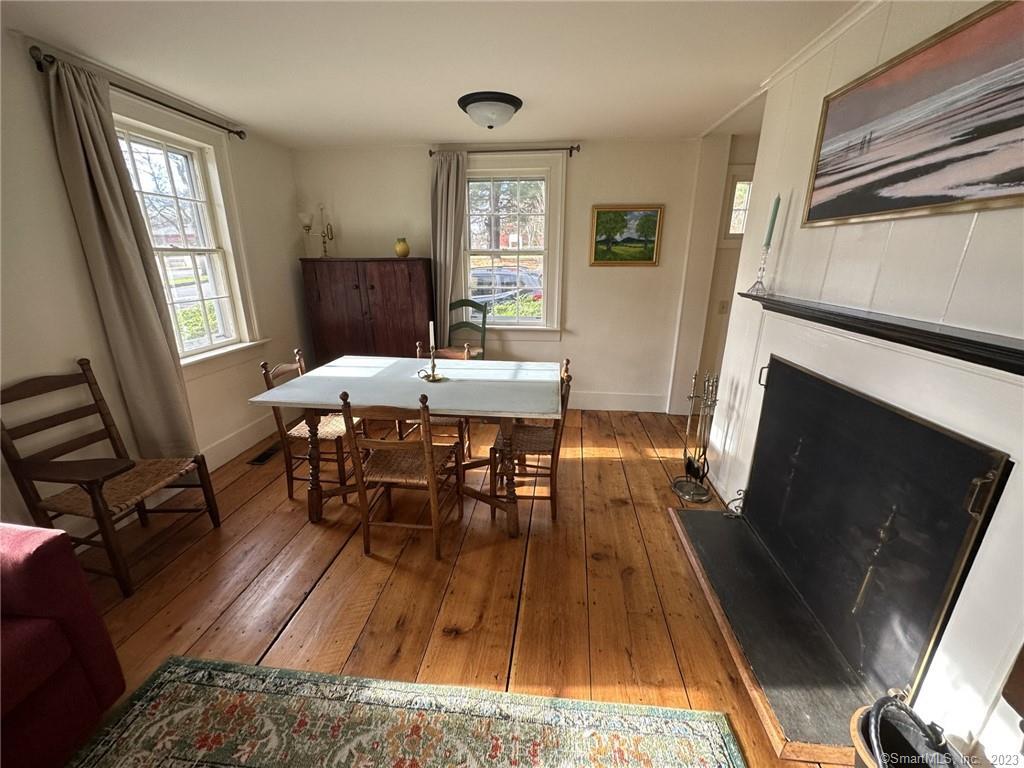 14 Quassuk Road, Unit 14 Woodbury, CT 06798 - Photo 8 of 23 a view of a dining room with furniture window and wooden floor