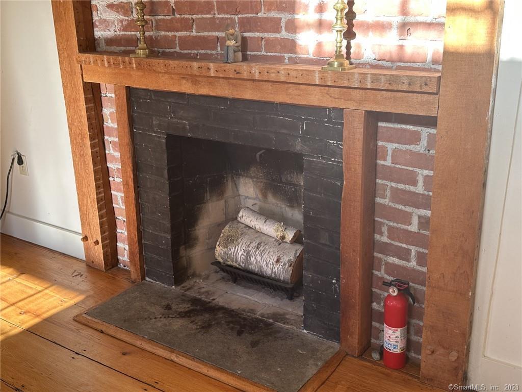 14 Quassuk Road, Unit 14 Woodbury, CT 06798 - Photo 9 of 23 a living room with furniture and a fireplace