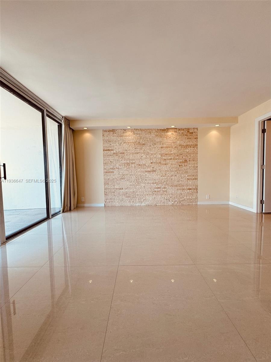 1901 Brickell Avenue, Unit B2106 Miami, FL 33129 - Photo 6 of 16 a view of an empty room with a window