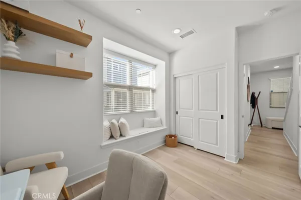 a spacious bedroom with a bed and a window
