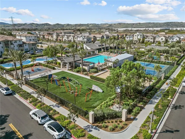 an aerial view of residential houses with outdoor space