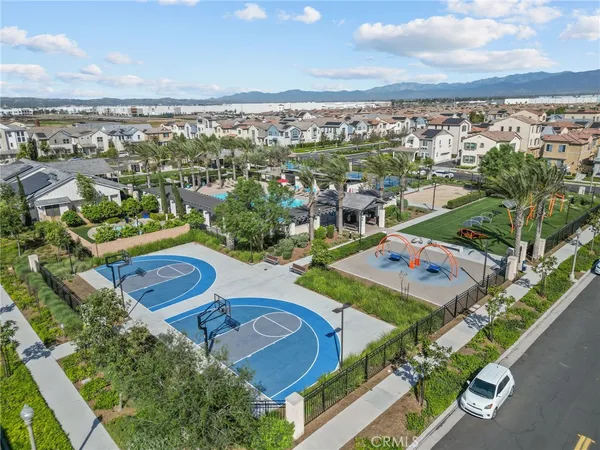 a view of multiple houses with outdoor space and a lake view