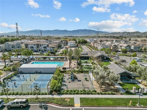 an aerial view of a house with garden space and street view