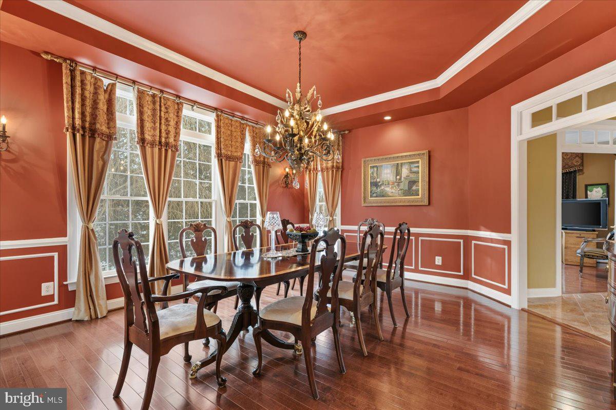 19606 Bellingham Lane Leesburg, VA 20175 - Photo 12 of 73 a view of a dining room with furniture window and wooden floor