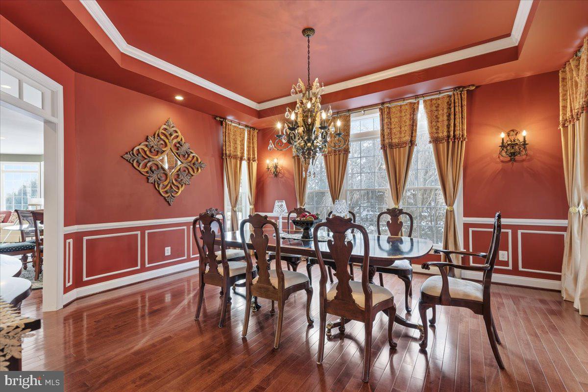 19606 Bellingham Lane Leesburg, VA 20175 - Photo 13 of 73 a view of a dining room with furniture window and wooden floor
