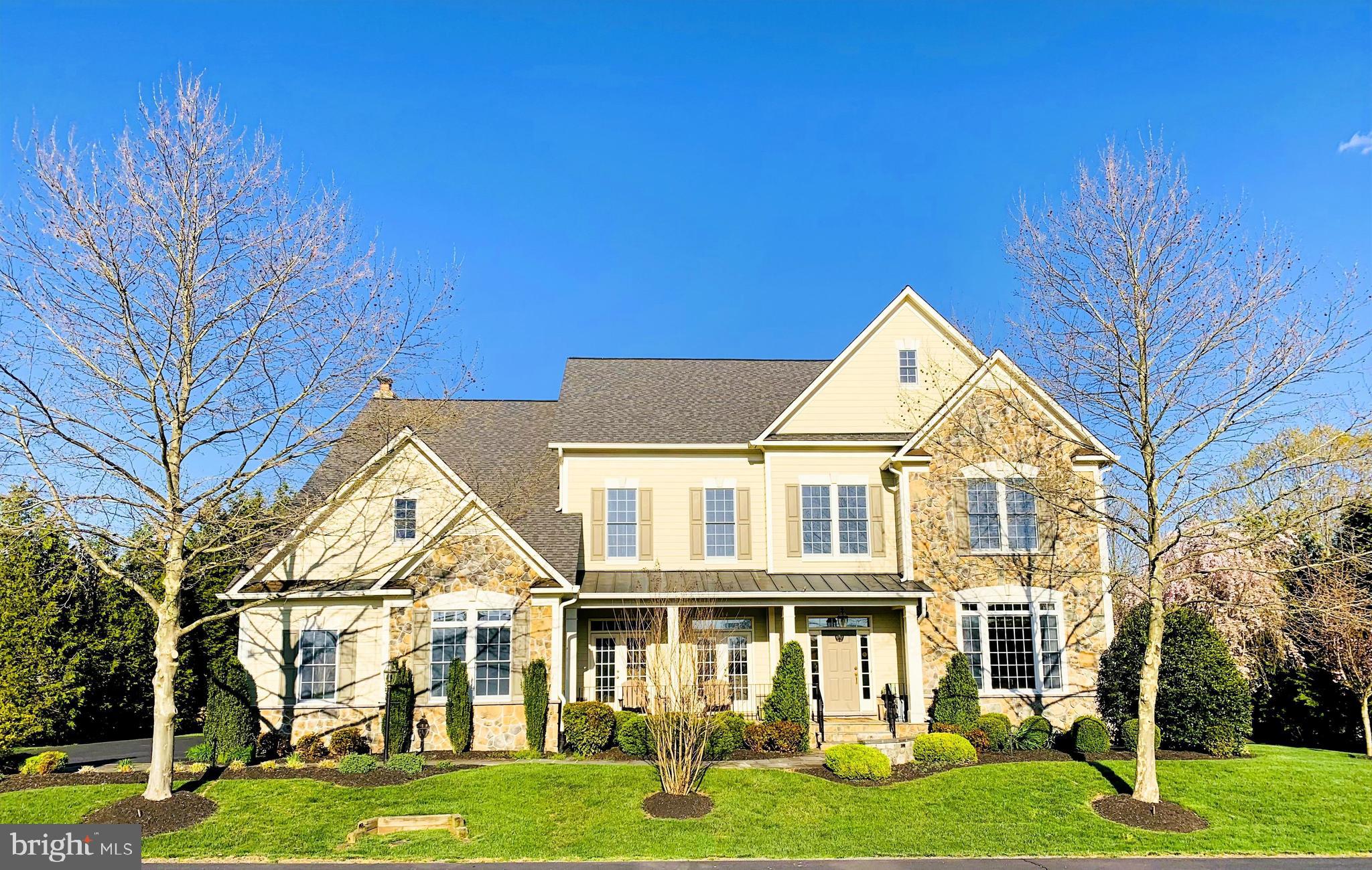 19606 Bellingham Lane Leesburg, VA 20175 - Photo 2 of 73 a front view of a house with a yard