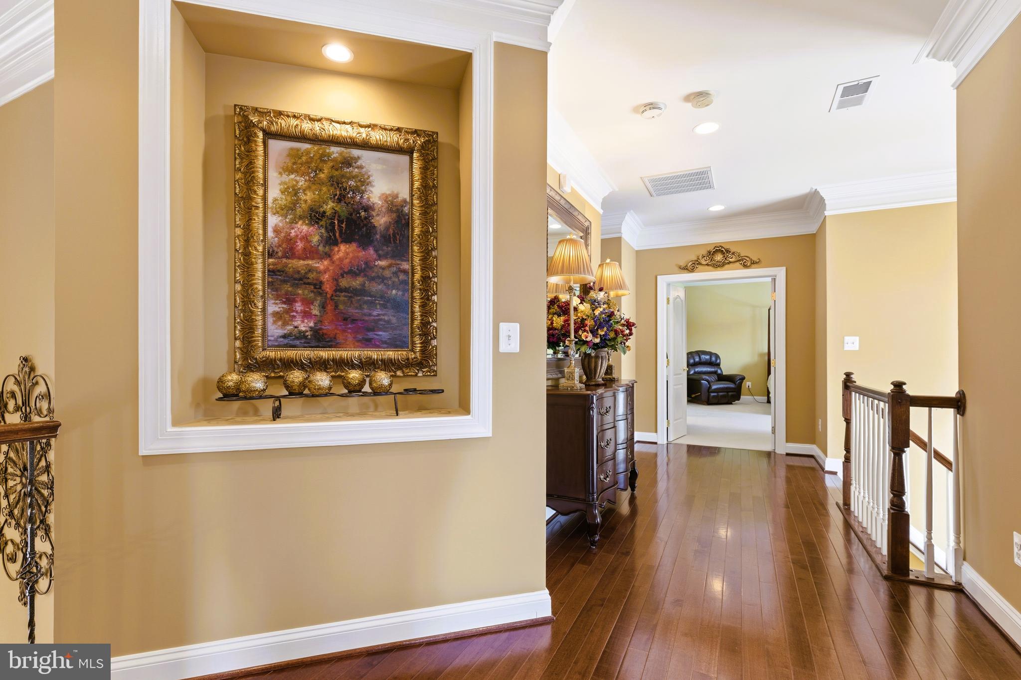 19606 Bellingham Lane Leesburg, VA 20175 - Photo 29 of 73 a view of a hallway with wooden floor and dining room