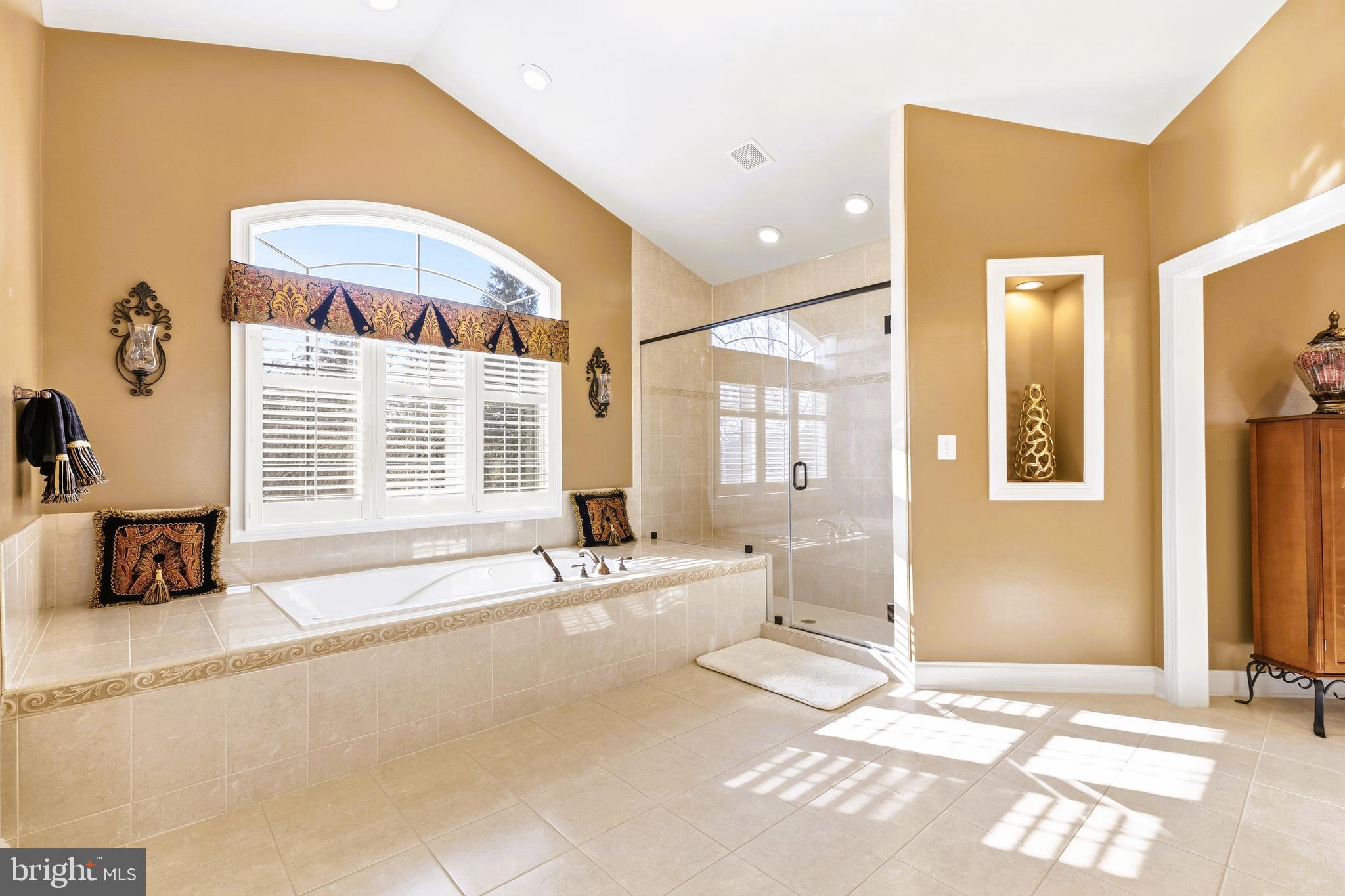 19606 Bellingham Lane Leesburg, VA 20175 - Photo 36 of 73 a spacious bathroom with a granite countertop tub and a large window