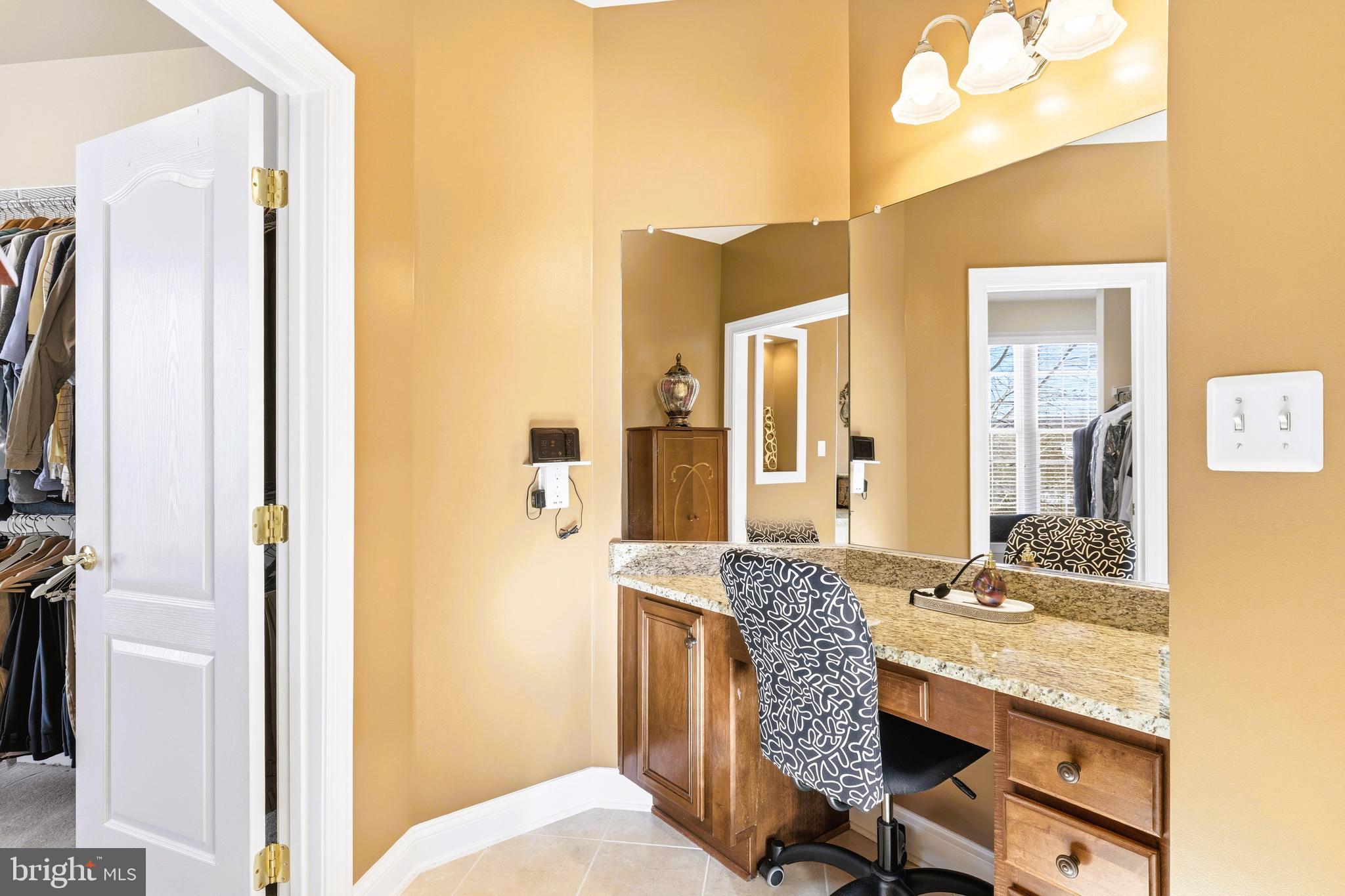 19606 Bellingham Lane Leesburg, VA 20175 - Photo 38 of 73 a en suite bathroom with a granite countertop sink and a mirror