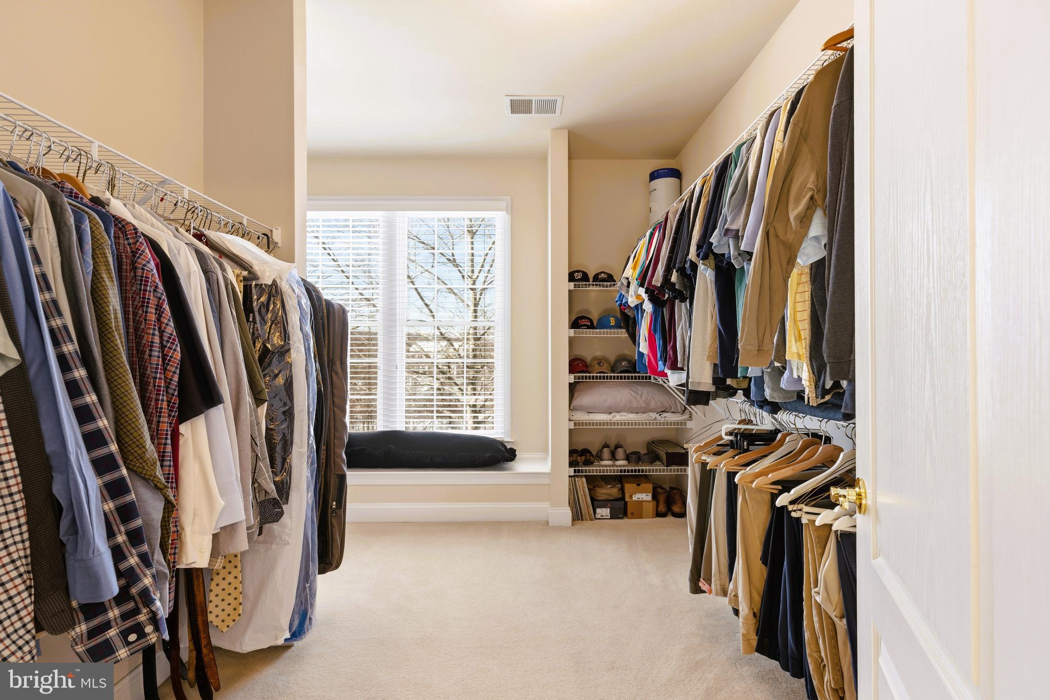 19606 Bellingham Lane Leesburg, VA 20175 - Photo 39 of 73 a view of walk in closet with clothes and shoes