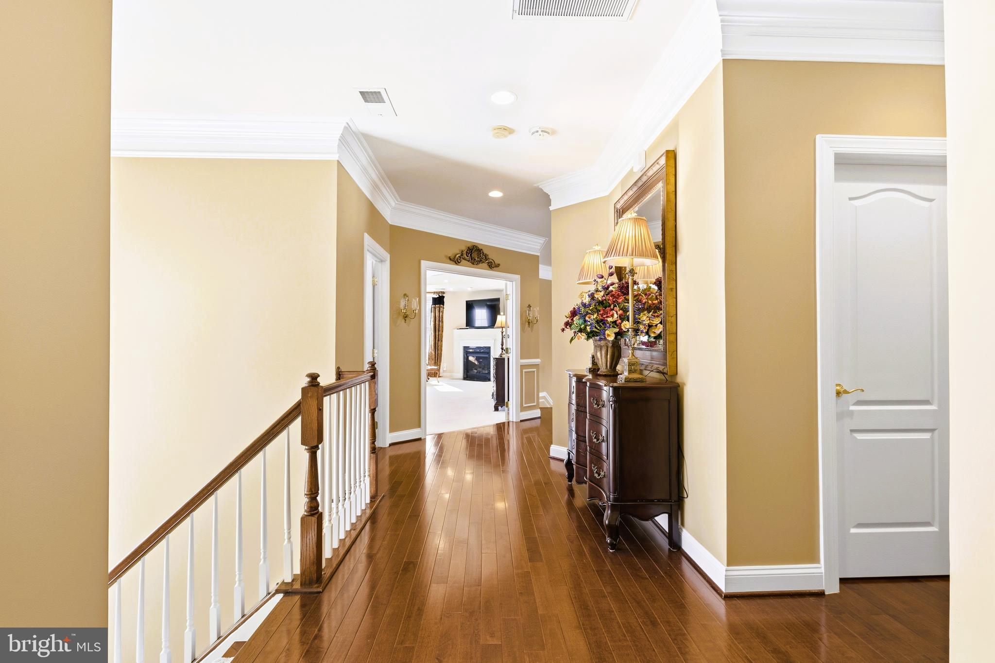 19606 Bellingham Lane Leesburg, VA 20175 - Photo 42 of 73 a view of a hallway with wooden floor