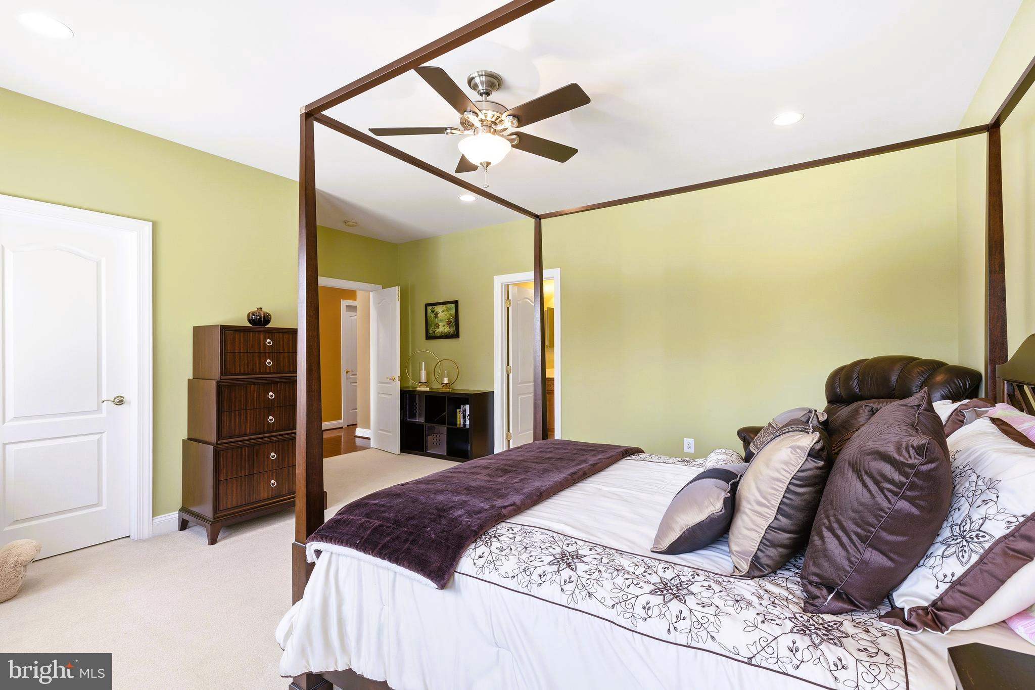 19606 Bellingham Lane Leesburg, VA 20175 - Photo 44 of 73 a bedroom with a bed and a walk in closet