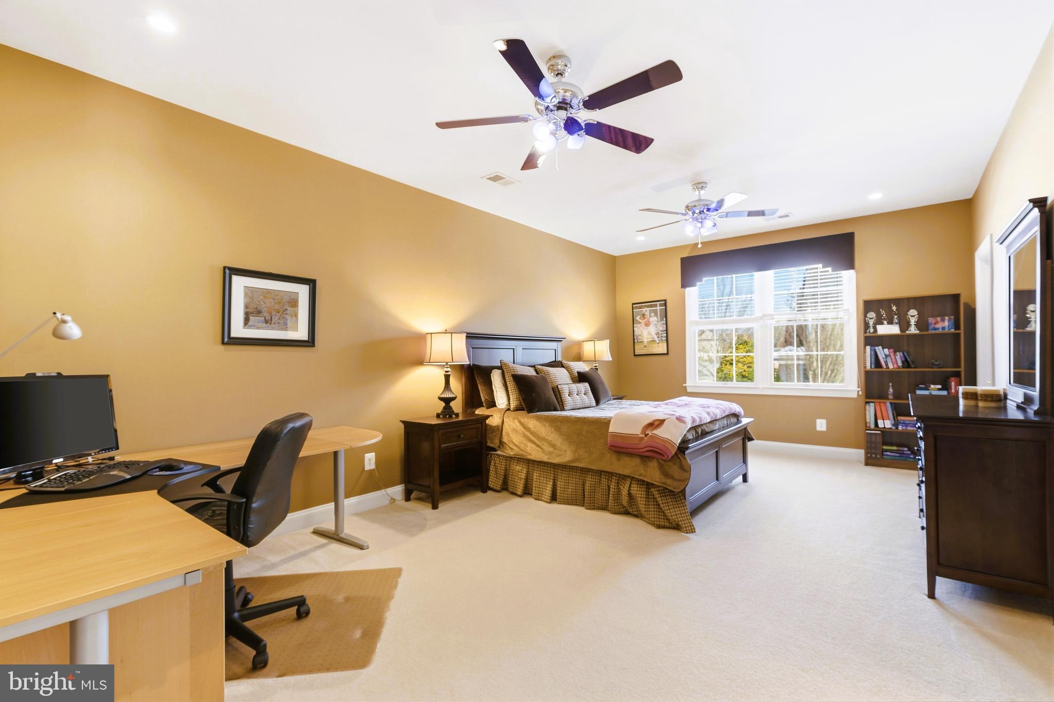 19606 Bellingham Lane Leesburg, VA 20175 - Photo 46 of 73 a living room with furniture gym equipment and a large window
