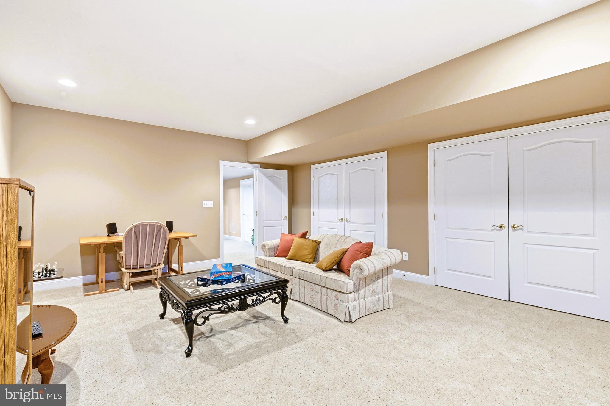 19606 Bellingham Lane Leesburg, VA 20175 - Photo 57 of 73 a living room with furniture and a rug