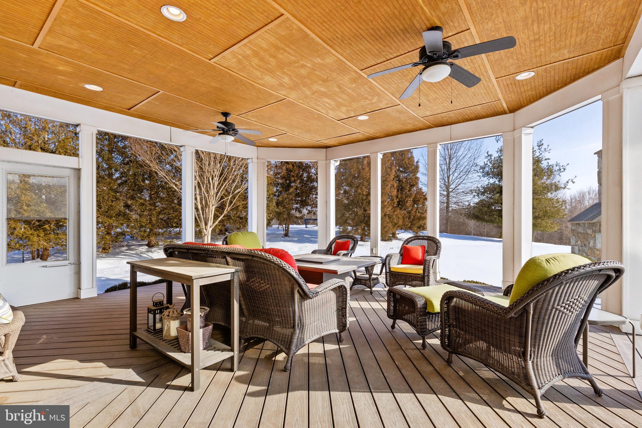 19606 Bellingham Lane Leesburg, VA 20175 - Photo 58 of 73 a view of a dining room with furniture large windows and wooden floor