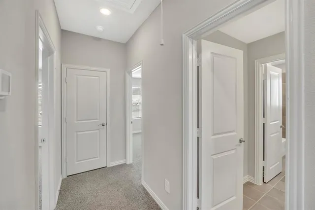 a view of a hallway with closet area