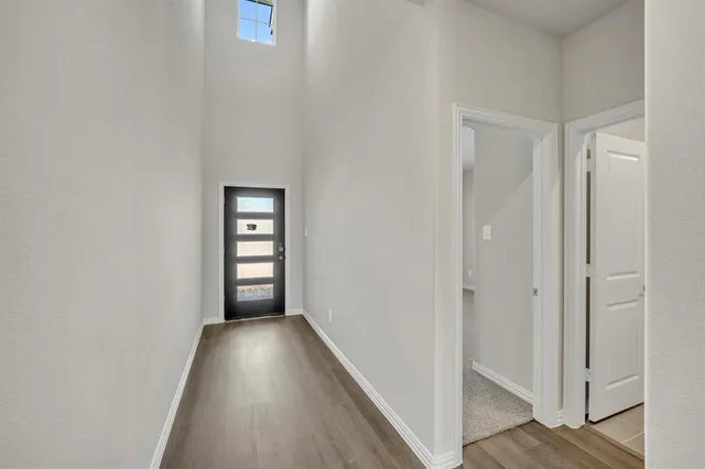 a view of kitchen with center island and wooden floor