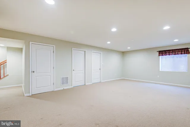 an aerial view of multiple houses with yard