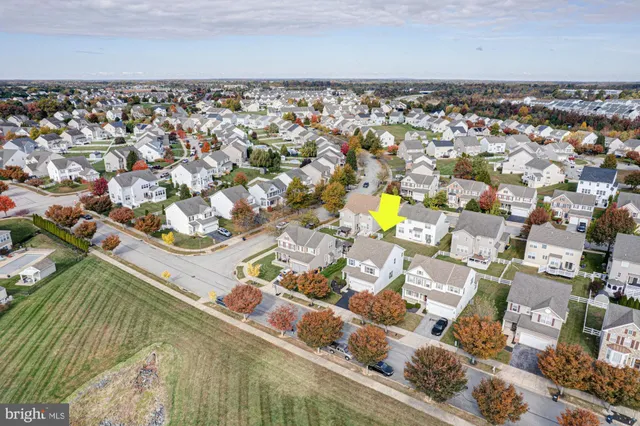 an aerial view of a house with a ocean view