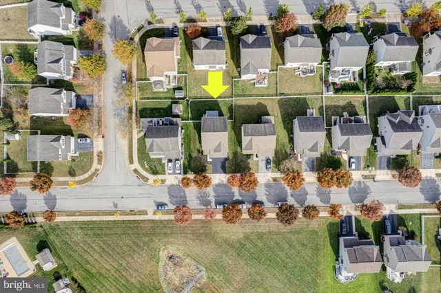 an aerial view of a house with a ocean view
