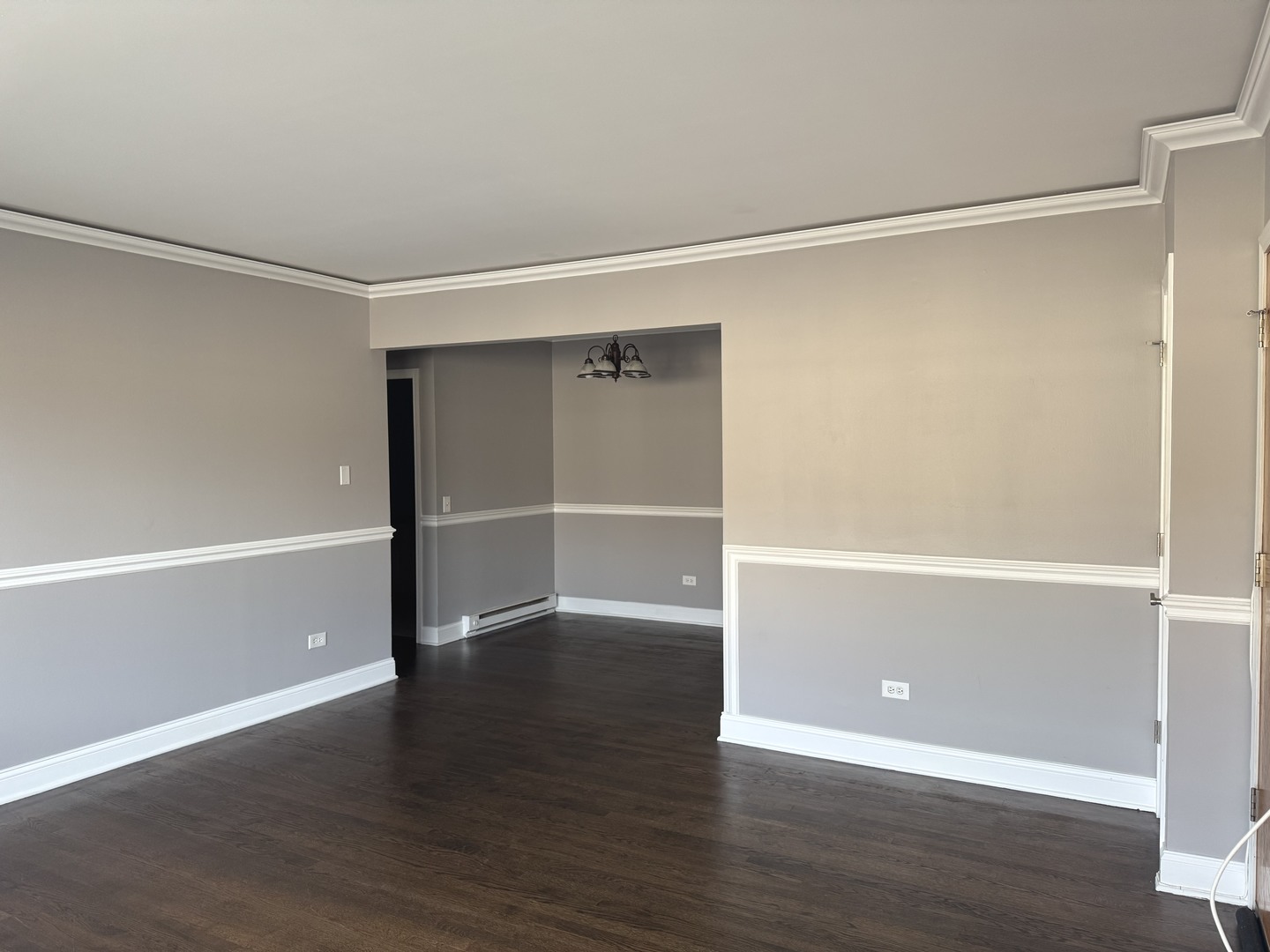 5041 North East River Road, Unit 3A Norridge, IL 60706 - Photo 2 of 12 a view of an empty room with wooden floor and a window