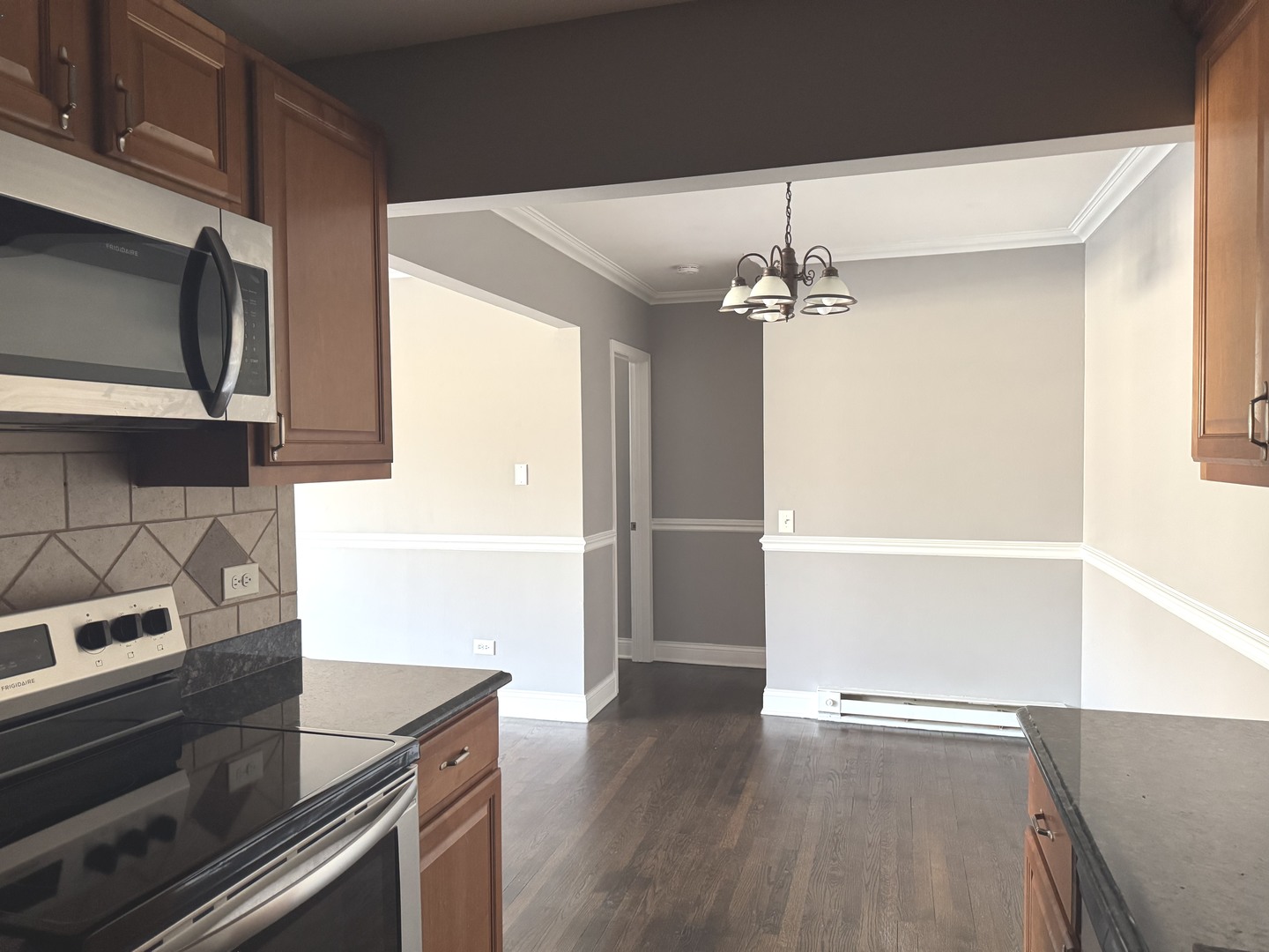 5041 North East River Road, Unit 3A Norridge, IL 60706 - Photo 8 of 12 a kitchen with a sink and a microwave