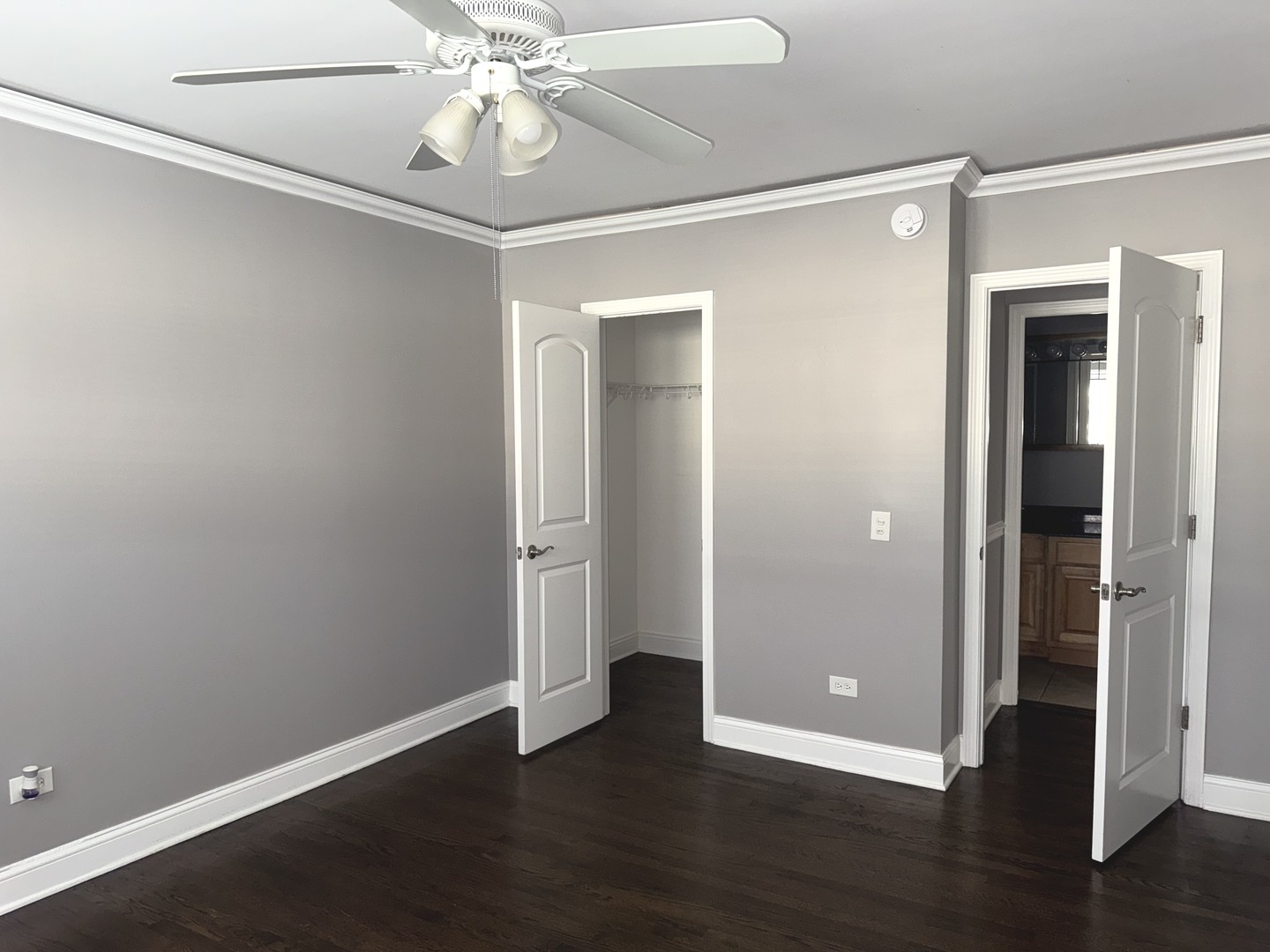 5041 North East River Road, Unit 3A Norridge, IL 60706 - Photo 9 of 12 an empty room with wooden floor closet and windows
