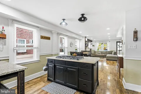 a kitchen with a stove a sink and a refrigerator