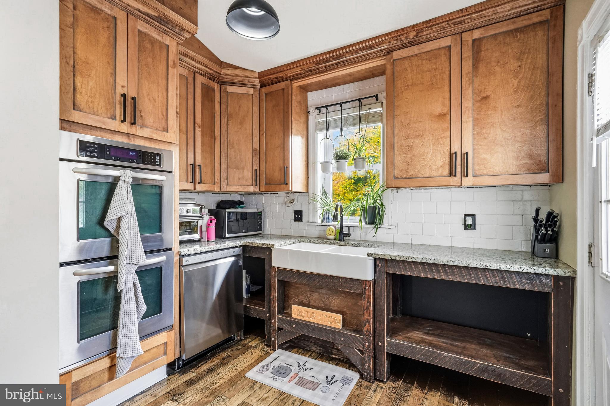8129 Hennig Street Philadelphia, PA 19111 - Photo 17 of 31 a kitchen with stainless steel appliances granite countertop a stove and a refrigerator