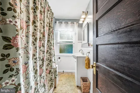 a bathroom with a bathtub and shower