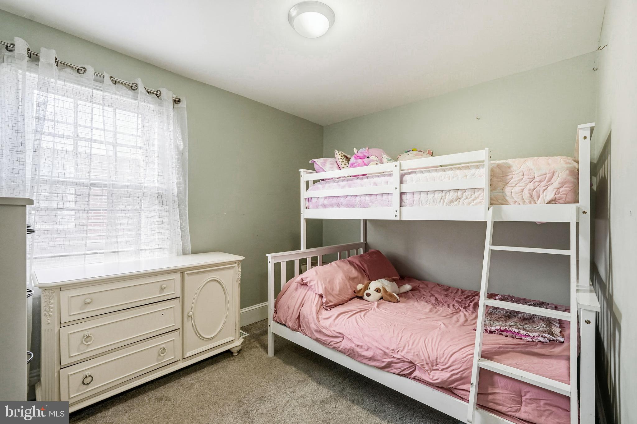 8129 Hennig Street Philadelphia, PA 19111 - Photo 22 of 31 a bedroom with a bed and a window