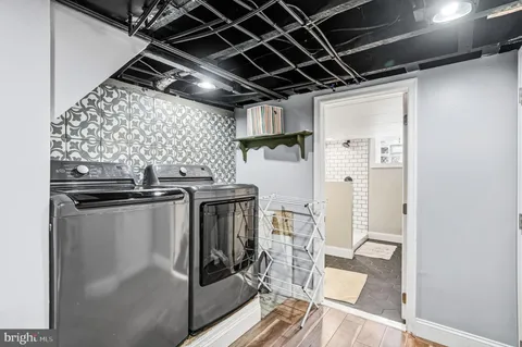 a kitchen with stainless steel appliances granite countertop a refrigerator and a stove