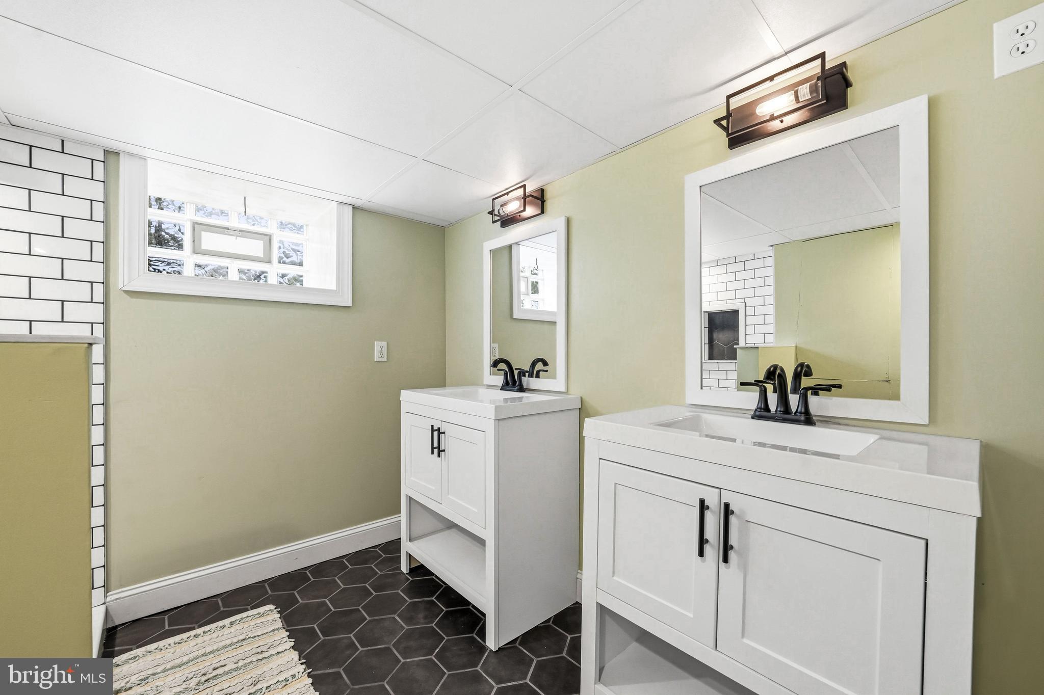 8129 Hennig Street Philadelphia, PA 19111 - Photo 26 of 31 a room with a sink and a mirror