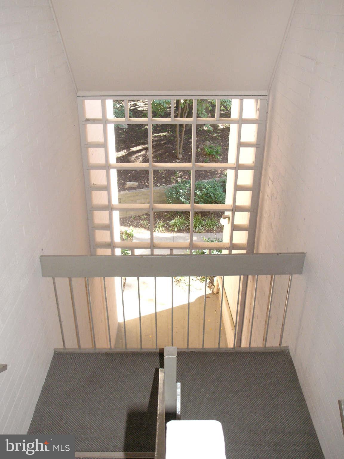 2210 Springwood Drive, Unit 208 Reston, VA 20191 - Photo 4 of 30 Building Stairway from landscaped sidewalk