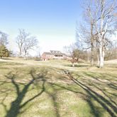 a view of yard covered with snow