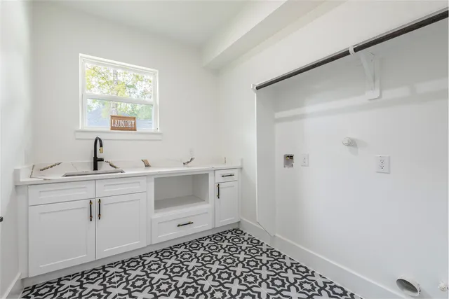 a bathroom with a sink and a window