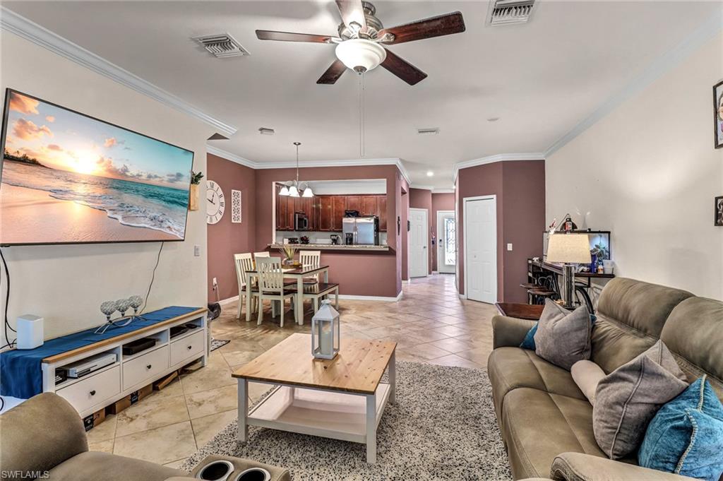 2722 Citrus Street Naples, FL 34120 - Photo 12 of 35 a living room with furniture and a flat screen tv