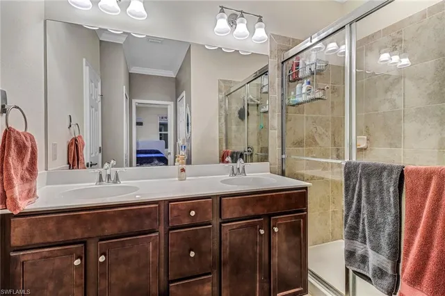 a bathroom with a double vanity sink mirror and double