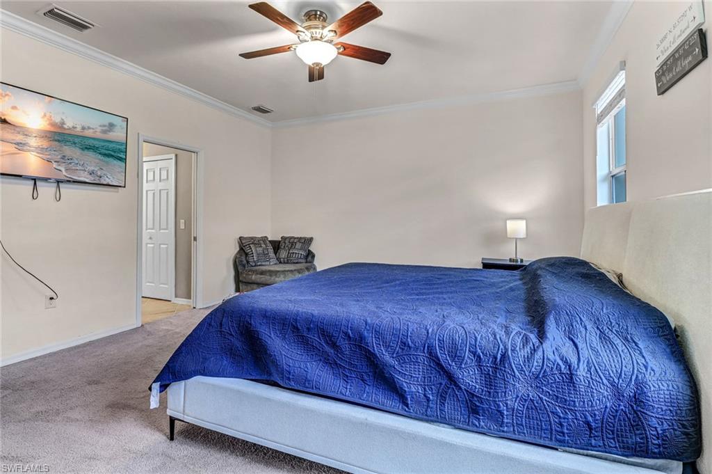 2722 Citrus Street Naples, FL 34120 - Photo 17 of 35 a bedroom with a bed and window